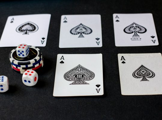 playing cards and dice on a table